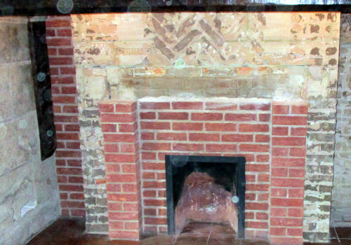 An Old Fireplace In Need Of Renovation
