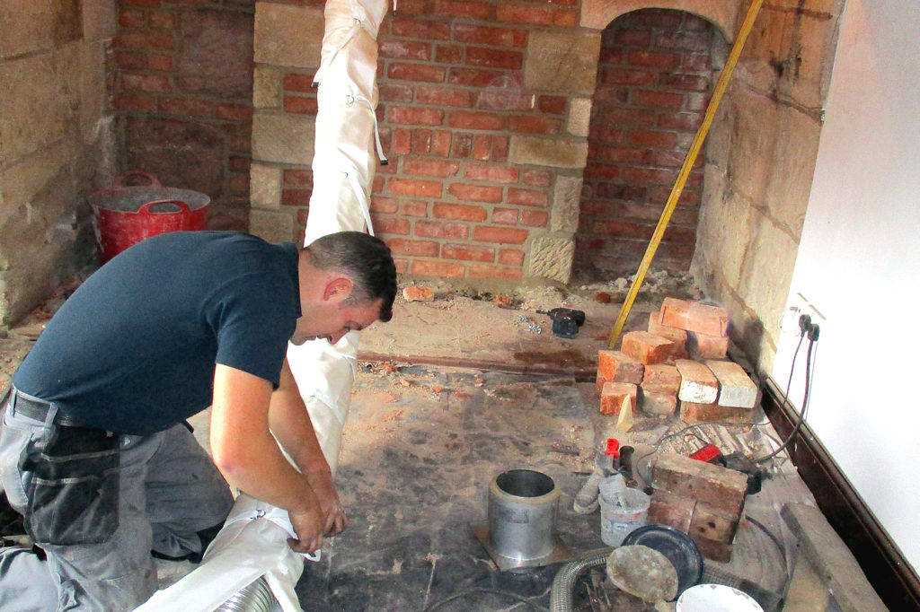 work being carried out on a fireplace renovation project